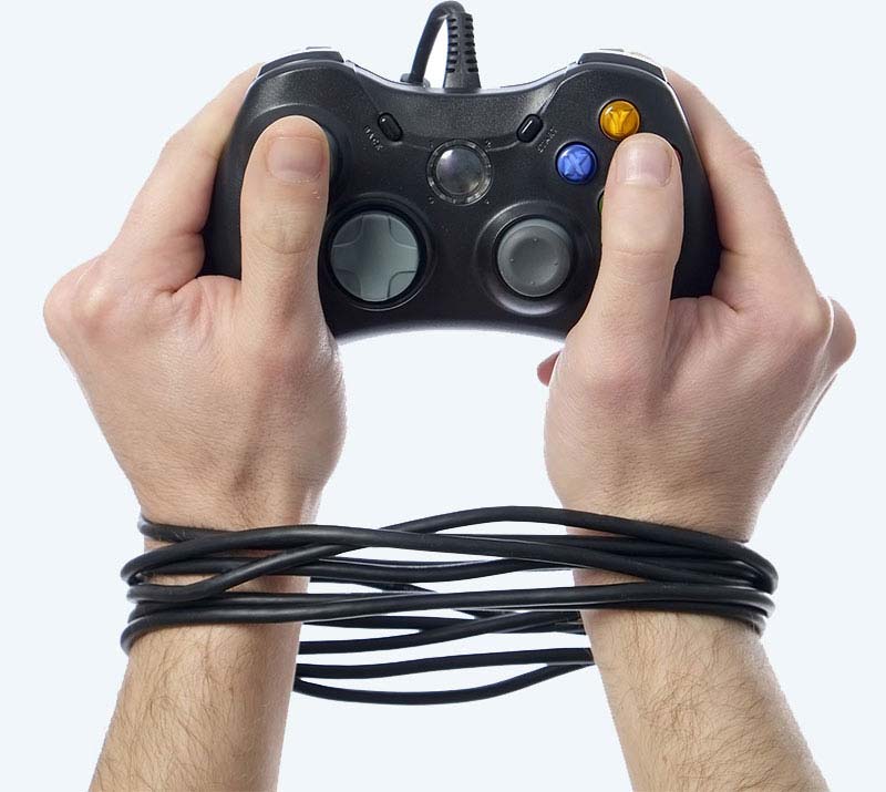 young man with video game addiction tied by a controller