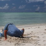 son with head in the sand